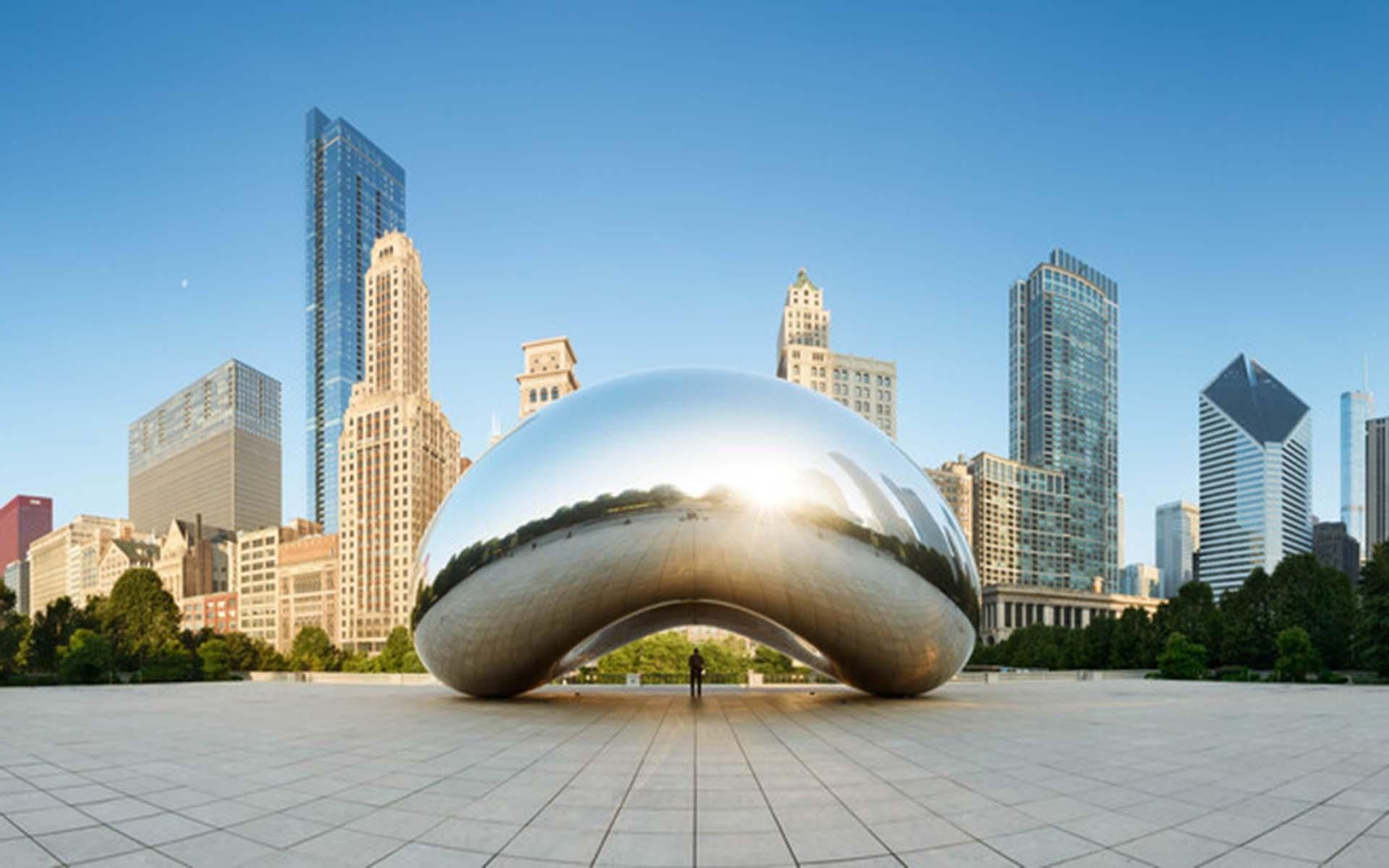 CHICAGO, ILLINOIS/USA-JUNE 30 2013: Panoramic image of the Cloud Gate or The Bean in the morning June 30 2013 in Millennium Park, Chicago, Illinois