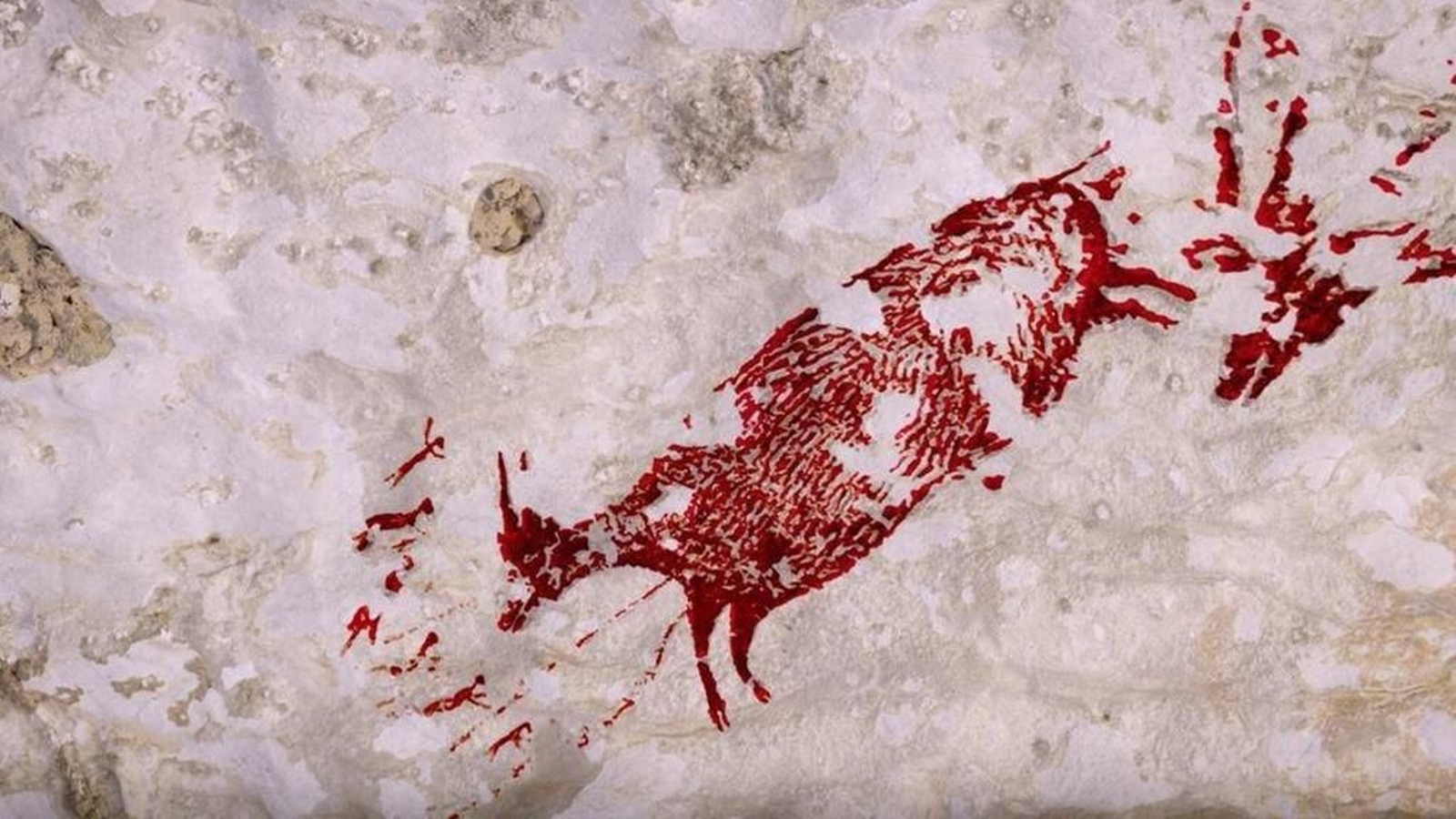 Escena de caza descubierta en la isla de Célebes, en Indonesia.