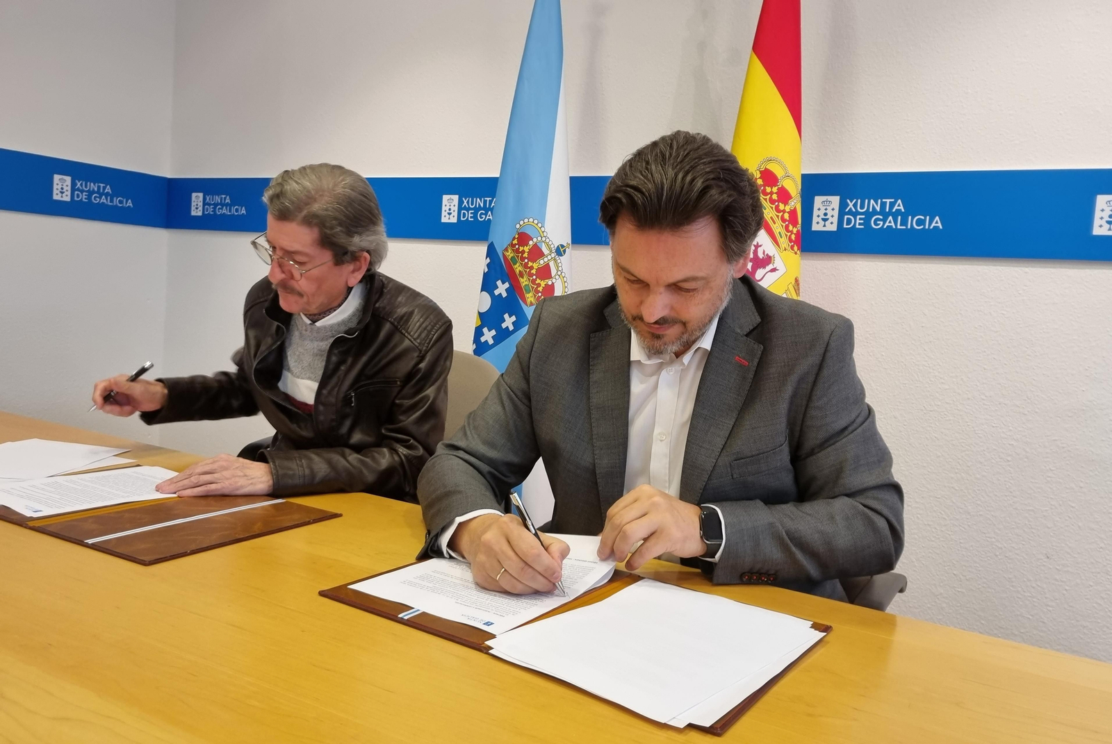 Miranda y Búa, en la sede de la SXE en la capital de Galicia, durante la firma del convenio
