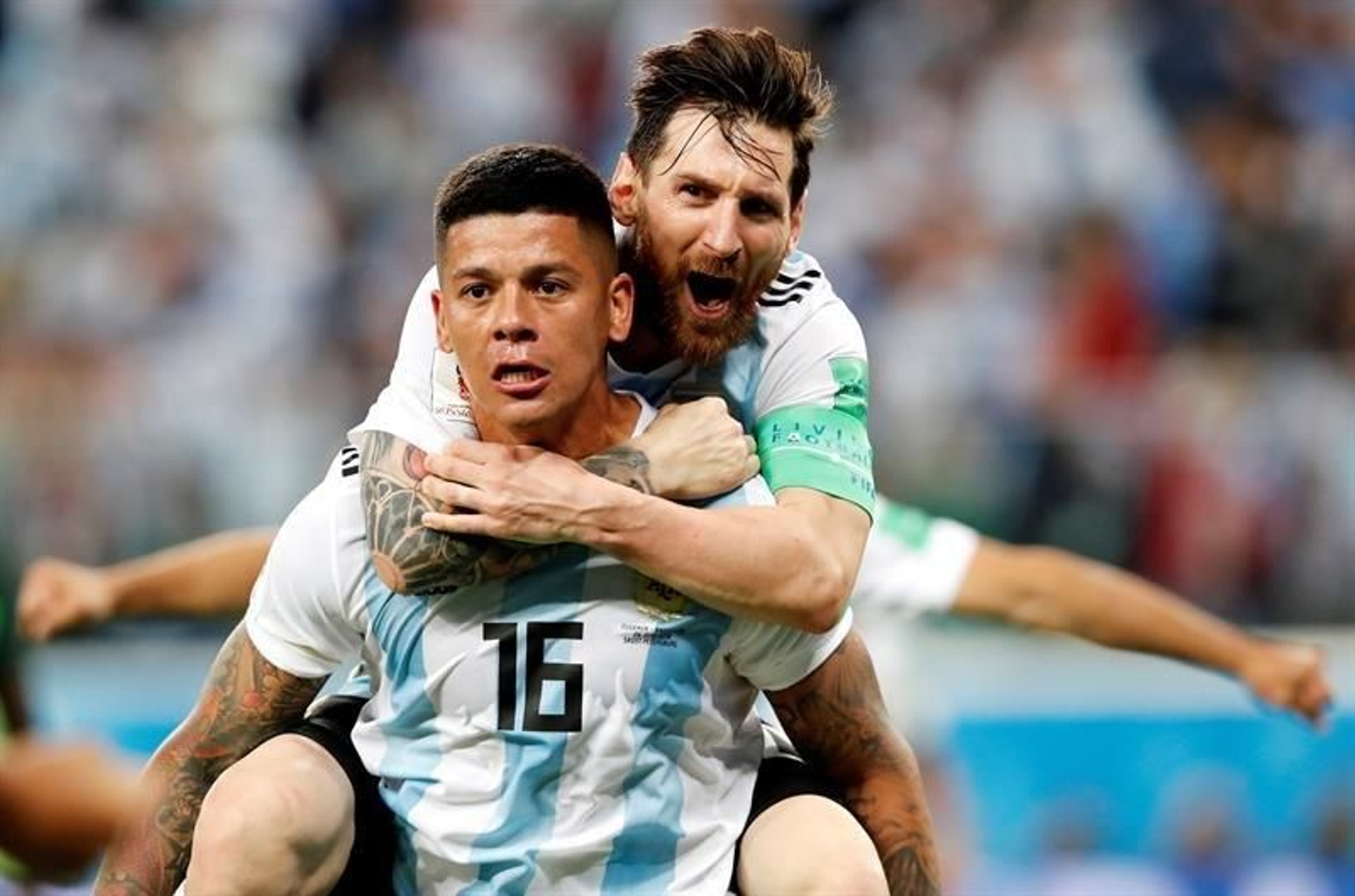 Marcos Rojo y  Lionel Messi